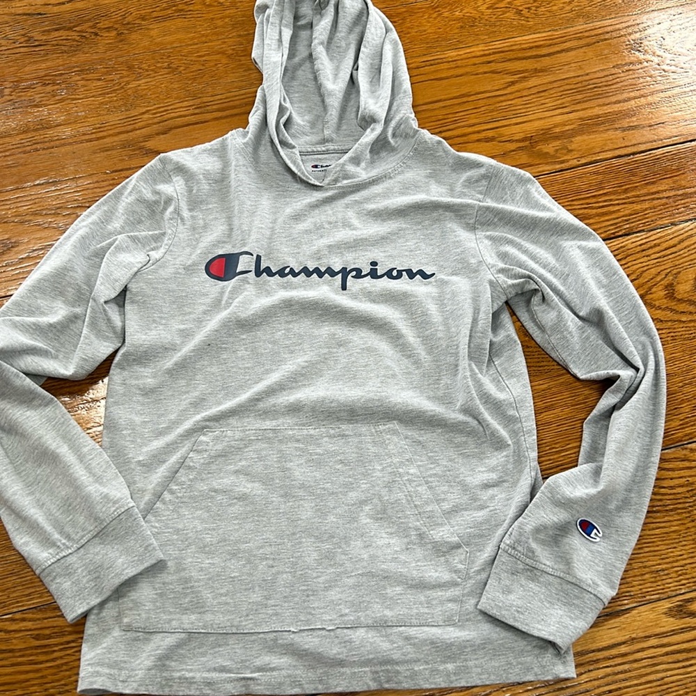 Champion brand girl’s tee shirt hoodie.  Size Large. Gray with Champion in blue